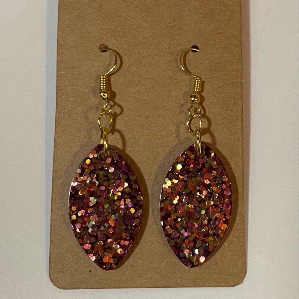 Handmade epoxy resin football shape earrings-fuscia glitter w/ green gold flecks